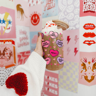 Cute and funny Valentine’s Day glass tumblers for her.
Playful Valentine’s drinkware featuring candy hearts.
Humorous Galentine’s coffee mug for girls' night.