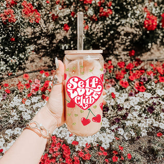 Women’s empowerment wholesale gifts with Self Love Club 20oz glass cups featuring red hearts, cherry graphics, and bamboo lids.
20oz glass cups with bamboo lid and glass straw for wholesale, featuring Self Love Club and motivational designs for women.