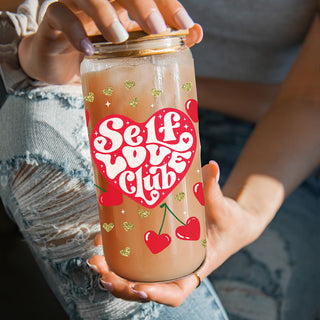 Wholesale 20oz glass cups with bamboo lid and glass straw featuring Self Love Club, perfect for motivational gifts for women.
Wholesale self love gifts for women with 20oz glass cups featuring Self Love Club and gold glitter hearts.