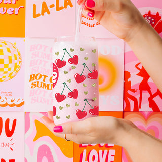 Wholesale Self Love Club 20oz glass cups with bamboo lid and glass straw for self growth and empowerment gifts.
20oz glass cups with bamboo lid and glass straw in bulk, featuring Self Love Club and red hearts for empowering gifts.