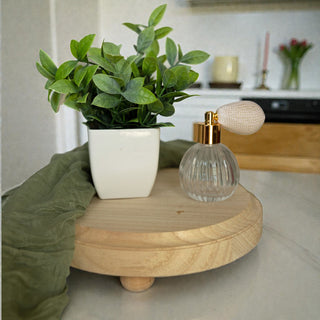 Natural wood round tray with raised feet close up view
Handmade Paulownia wood pedestal tray showing grain texture
Elevated wooden display tray natural finish 8.5 inches wide
Round wooden tray with legs farmhouse decor detail shot