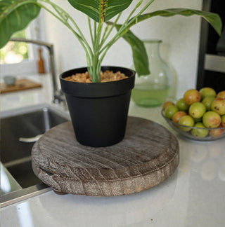 round wooden riser stand on kitchen counter
rustic distressed round wood pedestal tray
natural wood round tray stand with feet
farmhouse style wooden riser for candles
round wooden pedestal tray for kitchen decor