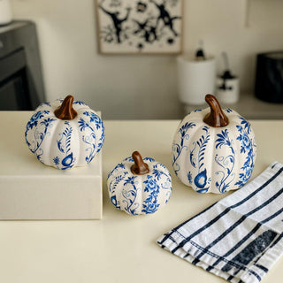 blue white pumpkins styled coffee table decor
chinoiserie pumpkin set styled kitchen counter
autumn decor pumpkins styled minimalist home
blue white pumpkins styled with neutral decor
fall styling blue white pumpkin home decor
pumpkins styled chinoiserie kitchen decor