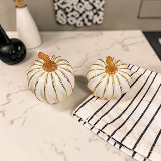 decorative white pumpkin with gold lines neutral autumn decor
small white pumpkins gold accents coffee table fall styling
elegant fall decor pumpkins white gold home accessories
white gold pumpkin decor styled in neutral kitchen aesthetic
minimalist fall decor white pumpkins gold accent styling
modern neutral home decor white pumpkins fall aesthetic
white pumpkin decor styled shelf neutral fall home
