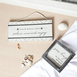 White wooden beach rules sign with modern design elements