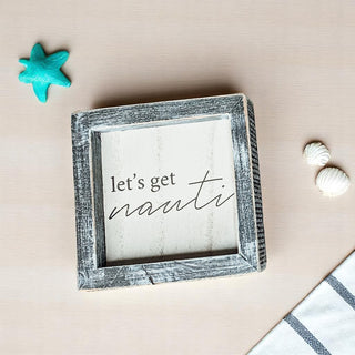 Beach house wall art featuring Let's Get Nauti text in farmhouse style frame