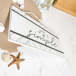 White wooden sign with geometric border and starfish accent
