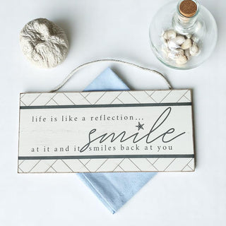 Life is like a reflection smile beach sign with geometric border