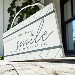 Cute inspirational coastal wall decor with rope hanging