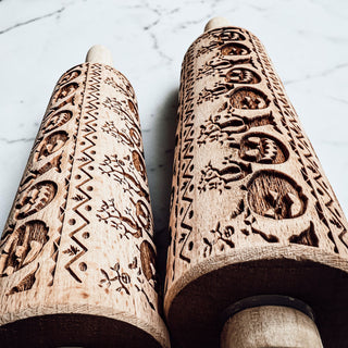 Halloween themed rolling pin for cookies
pumpkin engraved rolling pin on kitchen counter
cookie dough roller with Halloween pattern
embossed rolling pin for decorative cookies
wooden baking roller pumpkin detail close up
Halloween cookie making tools rolling pin
fall baking setup with pumpkin rolling pin