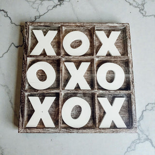 Bulk rustic distressed wood game board home decor
modern farmhouse coffee table decor with game
decorative wooden x and o pieces on game board
handmade USA wooden tic tac toe board on shelf
living room styling with tic tac toe game decor