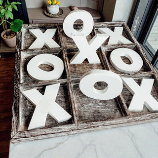 farmhouse neutral decor with interactive game
wood grain square tic tac toe tray with letters
decorative game board for modern farmhouse home
wooden xoxo decor tic tac toe set on countertop