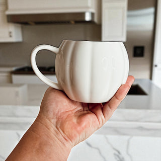 Autumn housewarming gifts - white and orange pumpkin coffee cups