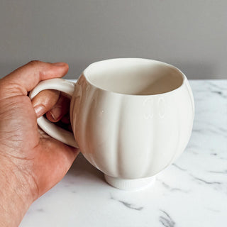September fall decor - ceramic pumpkin coffee mugs for autumn home styling
October Halloween prep - pumpkin shaped coffee cups for seasonal decorating