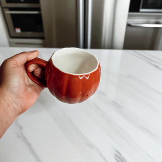 Fall season pumpkin shaped mugs - handcrafted ceramic drinkware for kitchen styling
Orange and white ceramic pumpkin cups - autumn home decor coffee accessories