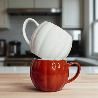 Fall gift ideas - ceramic pumpkin shaped coffee mugs in white and rust orange colors
Halloween gifts for coffee lovers - handmade pumpkin shaped ceramic mugs