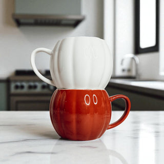 Unique handmade ceramic pumpkin shaped coffee mugs for fall and Halloween home decorating
White and rust orange pumpkin coffee mugs - artisan fall kitchen decor and Halloween gifts