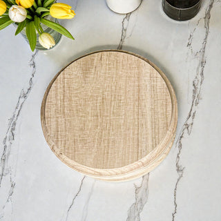 Handmade round wooden pedestal tray with raised feet! Perfect for displaying jewelry, candles & plants. Rustic farmhouse style in 2 finishes. Shop Gia Roma! #pedestaltray #farmhousedecor #jewelrydisplay #elevatedtray