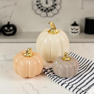 elegant ceramic pumpkins upscale fall decor
high end autumn decor pumpkins gold accent
refined fall decor pumpkin set modern home
neutral ceramic pumpkin set of 3 with gold stems for fall decor
modern pastel pumpkin decor for neutral autumn home styling