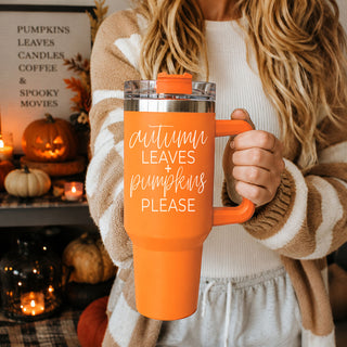 Fall 40oz Tumbler with handle
Celebrate cozy season with this stylish 40oz orange fall tumbler featuring the phrase “Autumn Leaves + Pumpkins Please” in a trendy autumn aesthetic design. 
This insulated stainless steel handled tumbler keeps drinks hot or cold for hours and includes a reusable straw with spill-resistant lid. Perfect for iced coffee, tea, water, apple cider, and pumpkin spice drinks during fall. A fun autumn tumbler gift for moms, teachers, coffee lovers, coworkers, pumpkin patch fans