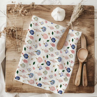 christmas dish towel close up ornament print
holiday kitchen towel styled with decor
christmas towel on wooden board baking setup
festive kitchen towel neutral home decor
christmas kitchen styling towel holiday setup
ornament print kitchen towel lifestyle photo