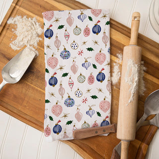 christmas dinner table prep kitchen towel
white kitchen towel christmas pattern ornaments
light neutral christmas kitchen towel decor
subtle christmas decor towel farmhouse kitchen