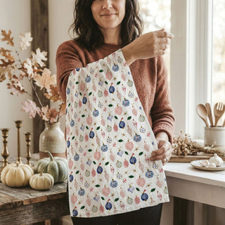 Christmas kitchen towel with ornament print
holiday tea towel with colorful ornaments
festive Christmas kitchen towel decor
seasonal ornament pattern dish towel
decorative holiday towel for kitchen
whimsical Christmas tea towel design