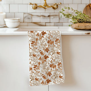 thanksgiving cotton hand towel with leaf design
fall foliage kitchen decor towel on counter
rustic autumn leaf dishcloth for seasonal baking
orange and brown leaf print fall tea towel
cozy autumn kitchen textiles with leaf towel
