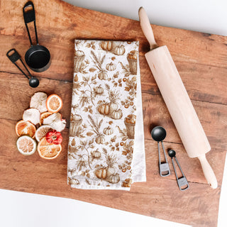fall baking pumpkin towel beside mixing bowl and whisk
pumpkin spice lover kitchen towel for seasonal décor
brown pumpkin and foliage towel for traditional thanksgiving
elegant pumpkin and wheat fall tea towel