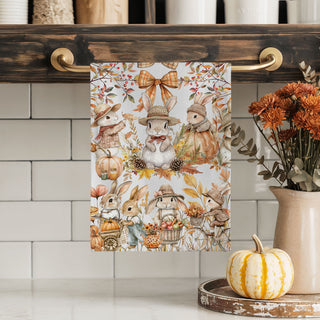 autumn leaf and bunny print flour sack dish towel
pumpkin spice season bunny kitchen towel
fall tea towel with bunnies pushing pumpkin cart
autumn bunny towel styled with pumpkins and cookbooks
cute woodland rabbit towel for nursery or play kitchen