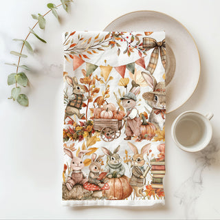 rustic fall towel with bunnies, books and pumpkins
cute bunny kitchen towel for fall housewarming gift
woodland creature autumn dish towel with rabbits and foliage
fall bunny and leaf garland towel for rustic thanksgiving table decor