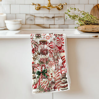 Bring sweet holiday charm to your kitchen with this candy cane Christmas kitchen towel! Featuring festive peppermint, gingerbread, ornaments, and cozy holiday designs, this soft and absorbent flour sack towel is perfect for decorating, gifting, or everyday use. A must-have for Christmas kitchens, hostess gifts, and festive home decor lovers