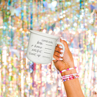 Speckled white mug with coffee attitude tracker