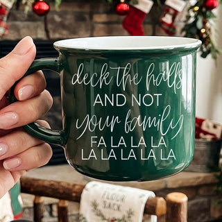 Bring humor to the holidays with our “Deck The Halls And Not Your Family” Christmas ceramic coffee mug. Available in festive red or green, this funny holiday mug is perfect for coffee lovers, hot cocoa nights, Christmas kitchen decor, Secret Santa gifts, stocking stuffers, and anyone surviving family gatherings one sip at a time.