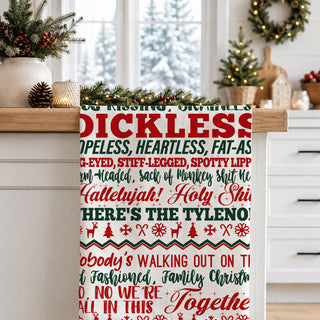 kitchen towel with funny quote in front of christmas tree
holiday towel held by woman festive outdoor setting
funny christmas towel styled cozy home background
kitchen towel with bold text styled holiday scene