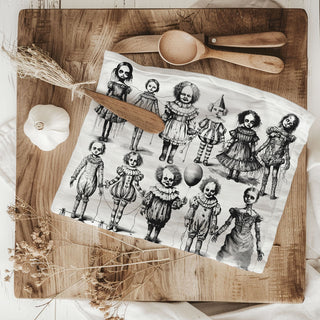 halloween decor flour sack towel with creepy toys and clowns
spooky black and white clown towel for haunted kitchen
horror themed halloween cotton towel for scary movie fans