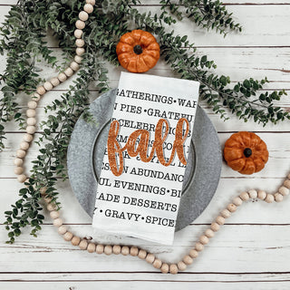 fall phrases towel draped on oven for seasonal décor
autumn kitchen textile with word art and fall script
fall-themed dish towel perfect for thanksgiving gift basket