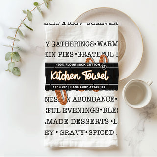 Wholesale word art fall dish towel styled
neutral white fall towel with bold orange fall script
autumn kitchen accent towel with seasonal sayings
fall baking towel with typography design and glitter effect