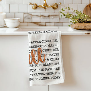 autumn gifting idea fall words towel with candle and mug
fall quote tea towel perfect for cozy cottage kitchen
autumn celebration towel listing pies cider and bonfires
fall kitchen linens set featuring word art towel