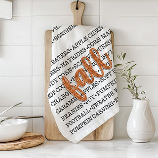 fall lettering towel perfect for pumpkin spice coffee station
autumn phrases tea towel hanging from cabinet handle
fall themed hostess gift with typography kitchen towel
cozy season cotton towel for cider bar and snack table