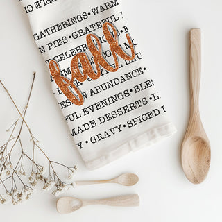 fall kitchen linens typography towel next to cutting board
autumn farmhouse dish towel with festive fall wording
pumpkin carving flannel cozy words fall towel
thanksgiving hostess gift fall words cotton kitchen towel