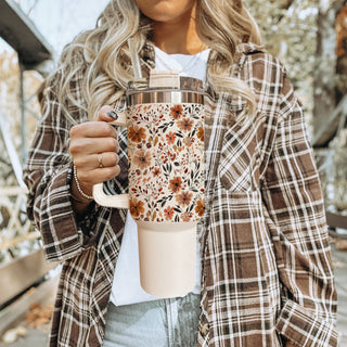 neutral aesthetic handled cup
fall tumbler for moms
autumn botanical tumbler
cozy floral travel mug
floral leaf tumbler design
minimal floral autumn tumbler
fall coffee tumbler aesthetic
cute seasonal floral cup
warm toned floral tumbler