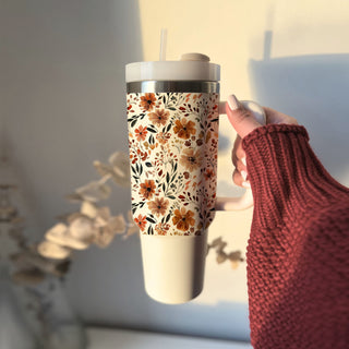 Wholesale Stay cozy all autumn long with this beautiful floral fall 40oz tumbler featuring a warm neutral flower pattern and insulated stainless steel design. Perfect for iced coffee, tea, water, or seasonal drinks, this handled tumbler keeps beverages hot or cold for hours and includes a reusable straw with spill-resistant lid in bulk