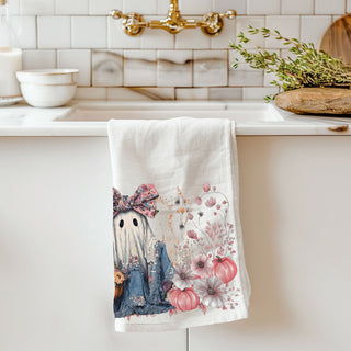 pink ghost kitchen towel for non scary halloween décor
floral ghost hand towel perfect for autumn gifting
cute spooky season towel with girly ghost and florals
ghost holding pumpkin flower basket fall dish towel
whimsical ghost with flower crown towel for fall décor lovers