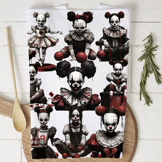 gothic halloween dish towel with creepy circus girls
scary clown face towel for haunted house kitchen
horror movie clown kitchen towel with balloons and blood