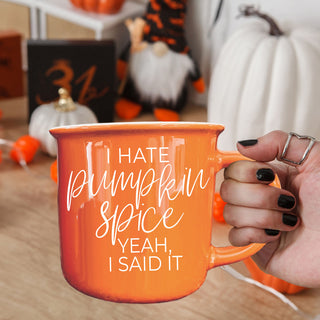 Wholesale orange ceramic autumn mug next to cozy socks
fall coffee break scene with humorous mug
autumn kitchen shelf decor featuring orange mug