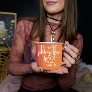 funny fall mug next to caramel drizzle dessert
halloween party coffee station with novelty mug
autumn office setup with laptop and sarcastic mug