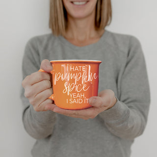 orange ceramic mug against rustic shiplap wall
fall themed hot drink station featuring orange mug
funny orange coffee cup on woven rattan tray