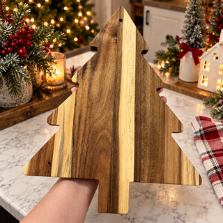 Christmas party serving platter
tree shaped wooden serving board
Christmas food serving board
holiday entertaining charcuterie board
Christmas tree kitchen board
Christmas acacia board displayed with candles and tabletop trees
Festive wooden serving board standing on a rustic kitchen shelf
