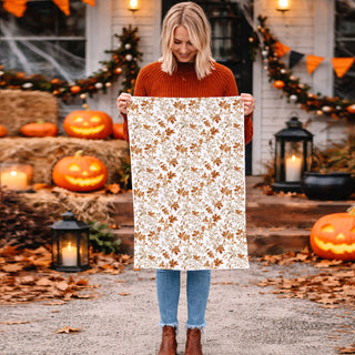 cozy fall baking scene with leaf print flour sack towel
autumn inspired kitchen towel for seasonal home deco